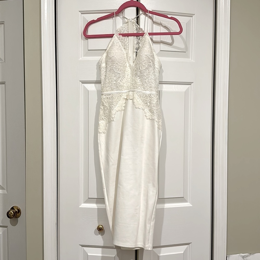 White dress perfect for wedding or rehearsal or bridal shower